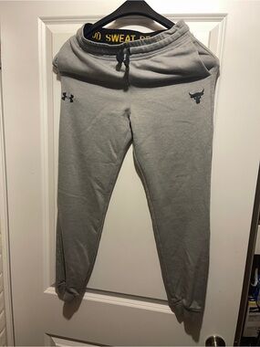 Under Armour Gray Fleece Sweatpants with Black Waistband and Yellow Text